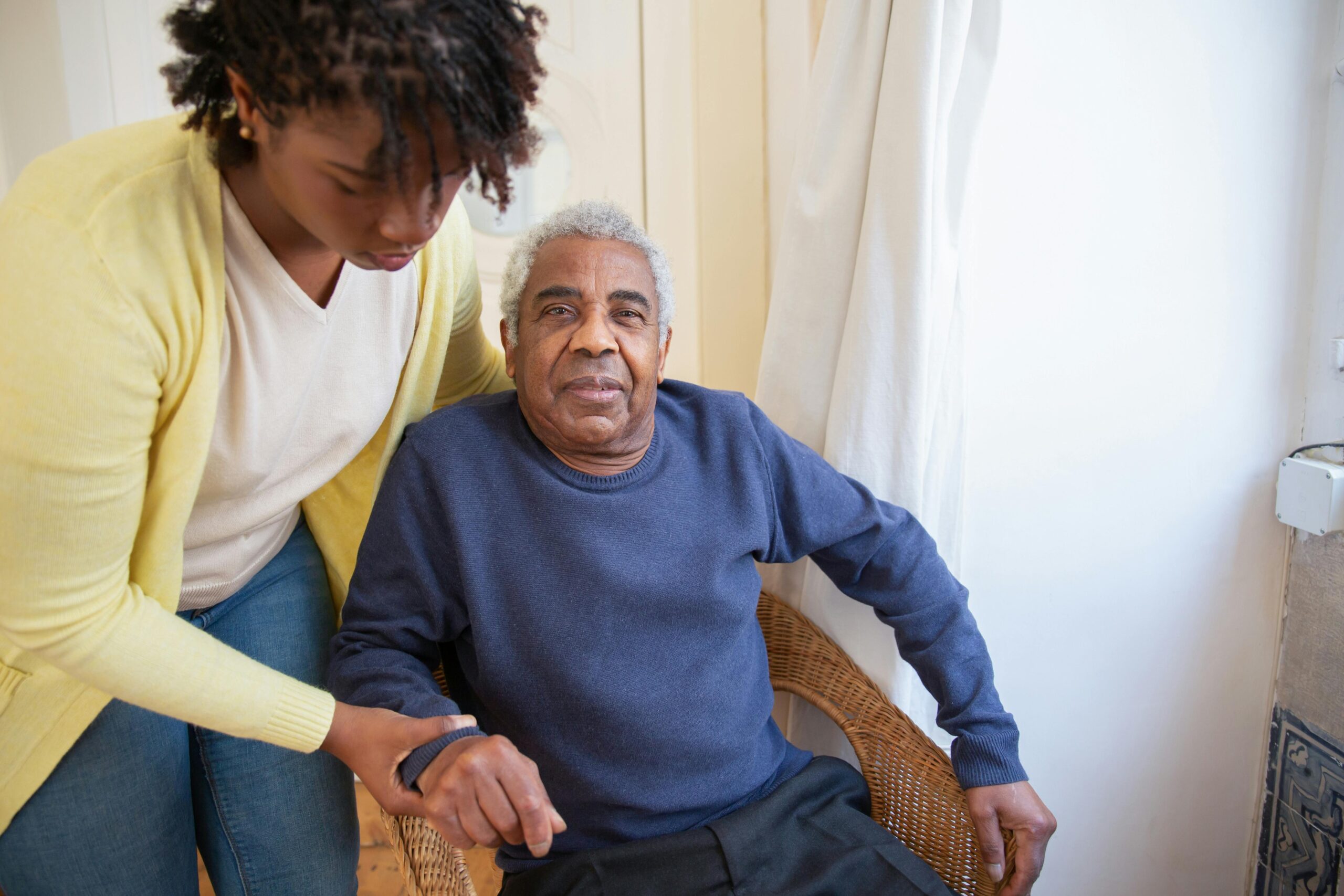 Home Health Aide helping senior